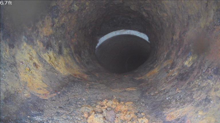 Sewer camera view showing an offset connection between pipe sections